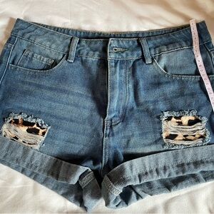Blue Jean Shorts with Distressed cheetah print “L” used